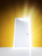 Open white door with rays of light on orange wall