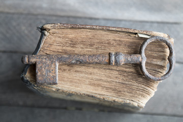 old key and vintage book