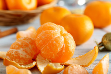 Wall Mural - Ripe mandarins on a blue wooden table