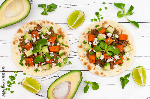 Fotografie, Obraz Mexican tacos with meat, sweet potatoes and cotija cheese