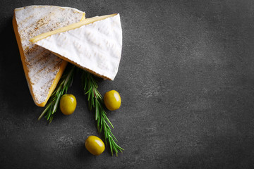 Wall Mural - Different kinds of cheese, olives and rosemary on grey background, copy space