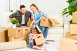 © JenkoAtaman - moving to new home. Happy family with cardboard boxes