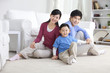 © Blue Jean Images - Young Chinese family with one son
