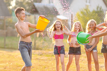 Wall Mural - Portrait of happy children on nature in summer