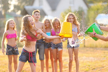 Wall Mural - Portrait of happy children on nature in summer