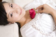 © Blue Jean Images - Asian woman with rose