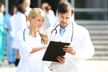 Canvas Print - Medical concept - two doctors with stethoscopes and prescription clipboard