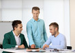 © Africa Studio - Three young business men at the meeting in a conference room