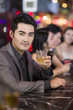 © Blue Jean Images - Young man drinking alcohol in bar