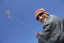 Man Flying A Kite On The Great Wall Of China