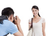 © Blue Jean Images - Man taking pictures of smiling wife