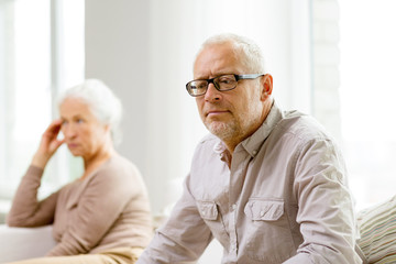 Canvas Print - senior couple sitting on sofa at home