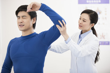 Female doctor examining patient