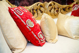 Fototapeta  - red cream cushions