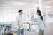 © Blue Jean Images - Mature couple reuniting at airport