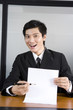 © Blue Jean Images - Businessman holding paper and pen