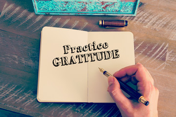 Wall Mural - motivational message practice gratitude written on notebook