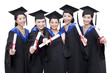 © Blue Jean Images - Portrait of alumnae holding diploma