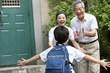 © Blue Jean Images - Grandparents welcoming their grandson