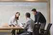 © Blue Jean Images - Business people having a meeting in board room