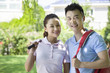 Young couple going to play tennis
