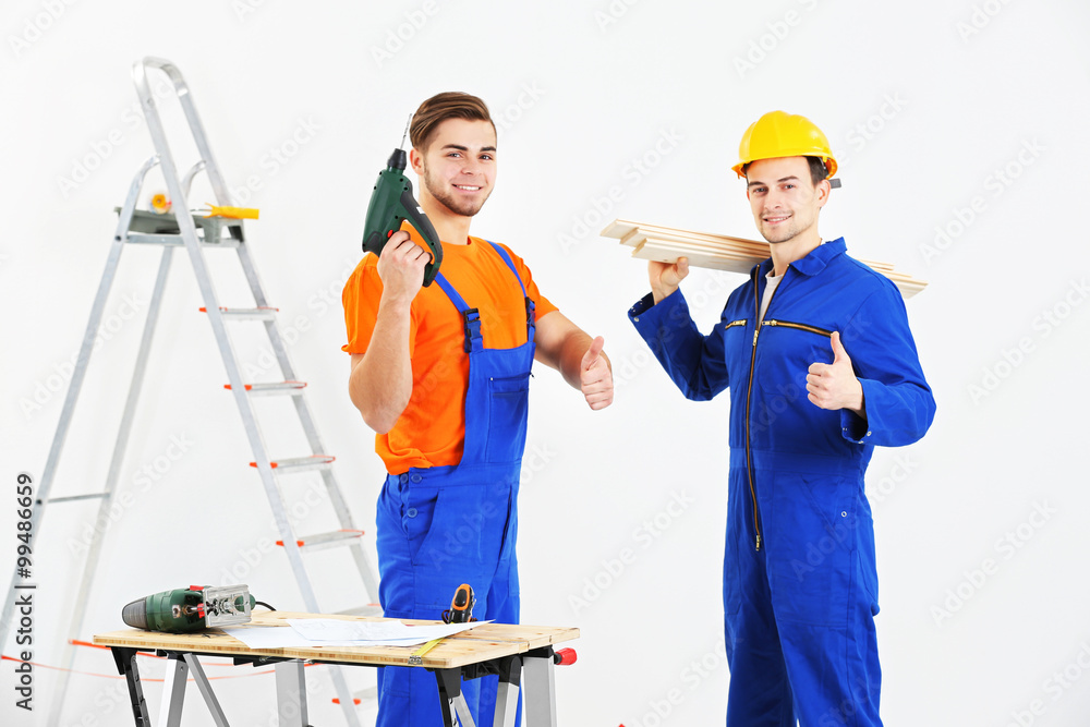 Two workers renewing apartment indoor