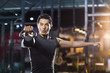 © Blue Jean Images - Young man training with kettlebell in crossfit gym