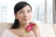 © Blue Jean Images - Asian woman with rose