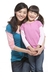 portrait of smiling mother and daughter