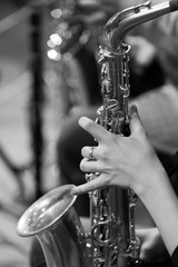 Wall Mural -  Hand girl playing the saxophone in black and white 