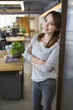 © Blue Jean Images - Young woman standing in office