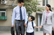 © Blue Jean Images - Chinese family ready for school and work