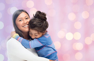 Wall Mural - happy mother and daughter hugging