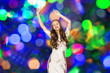 © Syda Productions - happy young woman dancing over disco lights