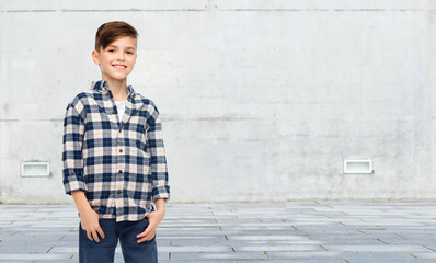 Canvas Print - smiling boy in checkered shirt and jeans