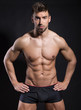 © Anetta - handsome young bodybuilder with toned body posing shirtless