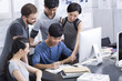 © Blue Jean Images - Young adults working in office