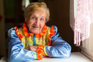 Wall Mural - Portrait of an elderly woman in ethnic costume.