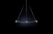 Hypnosis.
A silver pendulum swings on a dark background and symbolizes the hypnosis.
