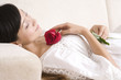 © Blue Jean Images - Asian woman with rose