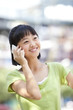 © Blue Jean Images - Portrait of schoolgirl on the phone