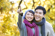 © Blue Jean Images - Young Couple Enjoying a Park in Autumn
