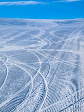 Groomed Ski Slope With Several Tracks