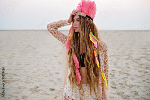 Fotografie, Obraz Boho chic beautiful model on the beach in peach colors
