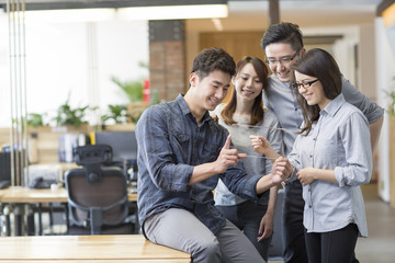 IT workers developing digital tablet