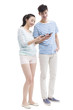 © Blue Jean Images - Happy young couple using smart phone