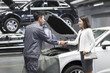 © Blue Jean Images - Auto mechanic and car owner shaking hands