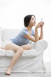 © Blue Jean Images - Young woman listening to music on smart phone