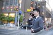 © Blue Jean Images - Young businessman talking on the phone
