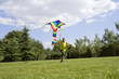 © Blue Jean Images - Young boy running with kite outdoors